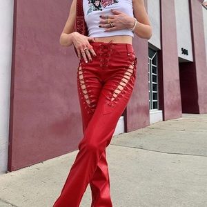 Lace up red faux leather tie pants